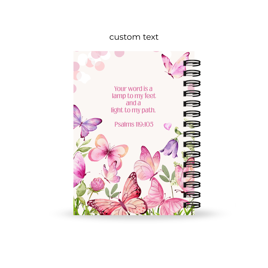 Christian journal with butterfly design and text on a white background