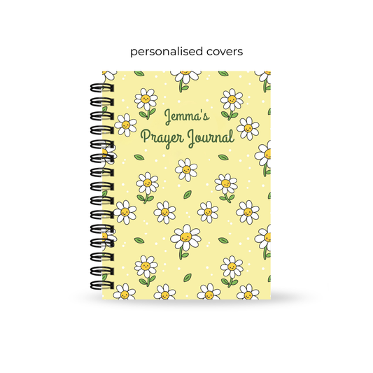Yellow Christian prayer journal for teens with daisy pattern on a white background
